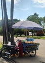 fresh green coconut seller with motorbike