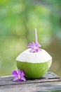 Fresh green coconuts with drinking straw