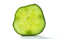 Fresh, green cucumber slice macro photo. Round slice of cucumber with seeds. Green pickle pulp