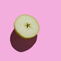 Fresh Green Cutted Apple isolated on pink background Royalty Free Stock Photo