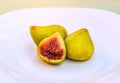 Figs on the white plate, jam cooking process. Royalty Free Stock Photo