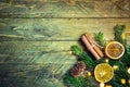 Fir tree branches cinnamon dried orange slices pine cones on old plank wood background. Golden bokeh lights. Christmas New Year Royalty Free Stock Photo