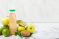 Fresh green fruit juice in a glass bottle, apple Royalty Free Stock Photo