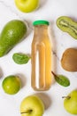 Fresh green fruit juice in a glass bottle, apple Royalty Free Stock Photo