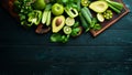 Fresh Green Fruits and Vegetables. Pure selection and source of vegetable protein on a wooden aged background. Royalty Free Stock Photo