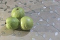 fresh green guavas on patterned surface Royalty Free Stock Photo