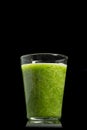 Fresh green healthy cucumber smoothie isolated on black background Royalty Free Stock Photo
