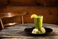 Fresh green homemade smoothie on the plate at wooden table Royalty Free Stock Photo