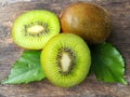 Fresh green kiwi, delicious slice fruit, arrange beautiful, wooden background Royalty Free Stock Photo