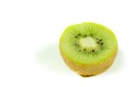 Fresh green kiwi fruit slice close up partially isolated on white background with selective focus, view from above Royalty Free Stock Photo