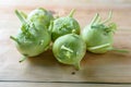 Fresh green kohlrabi or german turnip or turnip cabbage on wood background. Royalty Free Stock Photo