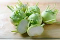 Fresh green kohlrabi or german turnip or turnip cabbage on wood background. Royalty Free Stock Photo