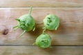 Fresh green kohlrabi or german turnip or turnip cabbage on wood background. Royalty Free Stock Photo