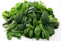 Fresh Green Leafy Vegetables Pile High on White Background