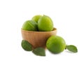 Fresh green lemon group in wooden bowl on white background