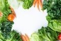 Fresh green lettuce salad and carrot, tomato, vegetables on white background, Top view with Coopy space