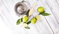 Fresh green lime with half and slice isolated on wooden background. Royalty Free Stock Photo