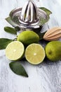 Fresh green lime with half and slice isolated on wooden background. Royalty Free Stock Photo