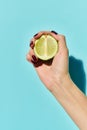 fresh green lime in hand of Royalty Free Stock Photo