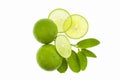 Fresh green limes with slices and leaf isolated on white background. Royalty Free Stock Photo