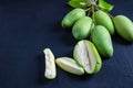 Fresh green mango fruit on a wooden table. Royalty Free Stock Photo