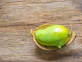 Fresh Green mango (Rhino Mango) on wood background