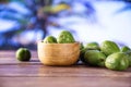 Fresh green mini baby kiwi fruit with palm each behind Royalty Free Stock Photo