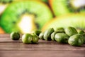 Fresh green mini baby kiwi fruit with sliced kiwi Royalty Free Stock Photo