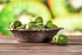 Fresh green mini baby kiwi fruit with sliced kiwi Royalty Free Stock Photo