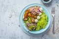 Fresh green mixed salad bowl with tuna, mozzarella and microgreens