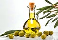 Fresh green olives and a bottle of olive oil, with a branch with leaves. Royalty Free Stock Photo