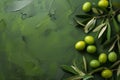 Fresh Green Olives With Leaves on a Textured Olive-Colored Background