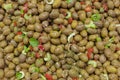 Fresh green olives, with spicy red pepper and parsley on sell in