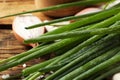 Fresh green onion on wooden table, closeup Royalty Free Stock Photo