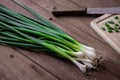 Fresh green onion on wooden table Royalty Free Stock Photo