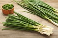 Fresh green onions on a cutting board on grey wooden background Royalty Free Stock Photo