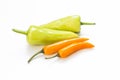 Fresh green and orange color chilli on white background