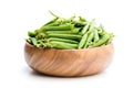Fresh green pea pods in wooden bowl isolated on white Royalty Free Stock Photo