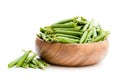 Fresh green pea pods in wooden bowl isolated on white Royalty Free Stock Photo