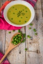 Fresh green pea soup with pea seeds. Royalty Free Stock Photo