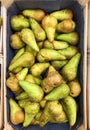 Fresh green pears on the market in a box Royalty Free Stock Photo