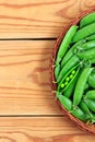 Fresh green peas in a basket Royalty Free Stock Photo