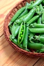 Fresh green peas in a basket Royalty Free Stock Photo