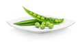 Fresh green peas in a ceramic white plate on white background Royalty Free Stock Photo