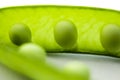 Fresh green peas close up on a white background, macro photography