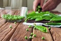 Fresh green peas close-up on wooden background