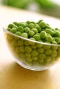 Fresh green peas in glass bowl Royalty Free Stock Photo