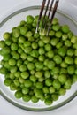 Fresh green peas are on a plate