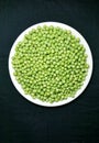 Fresh green peas seed in white plate Royalty Free Stock Photo