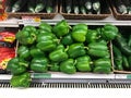 Fresh Green Peppers for sale in a produce department of a grocery store